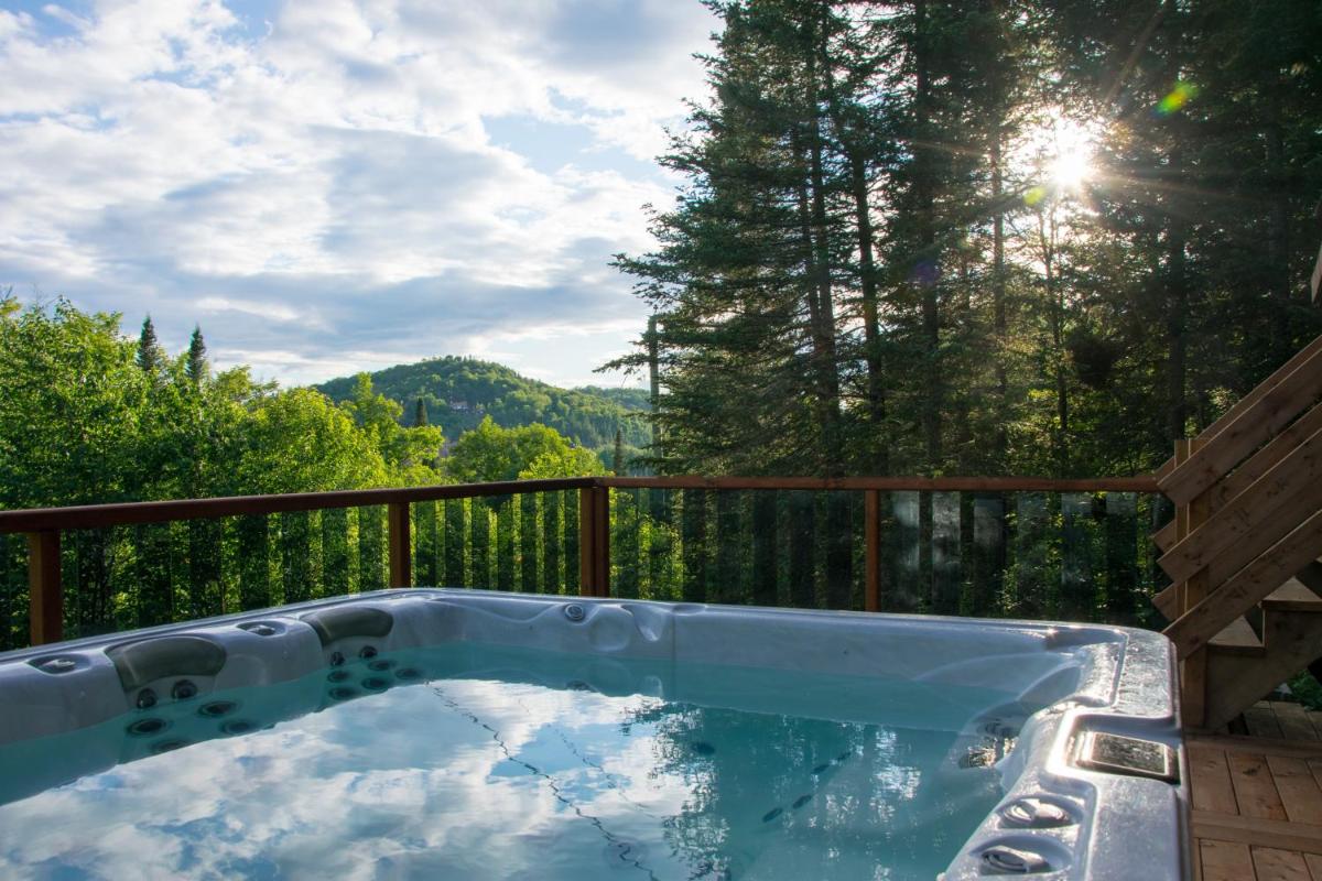 Image 2 of Breathtaking log house with HotTub – Summer paradise in Tremblant